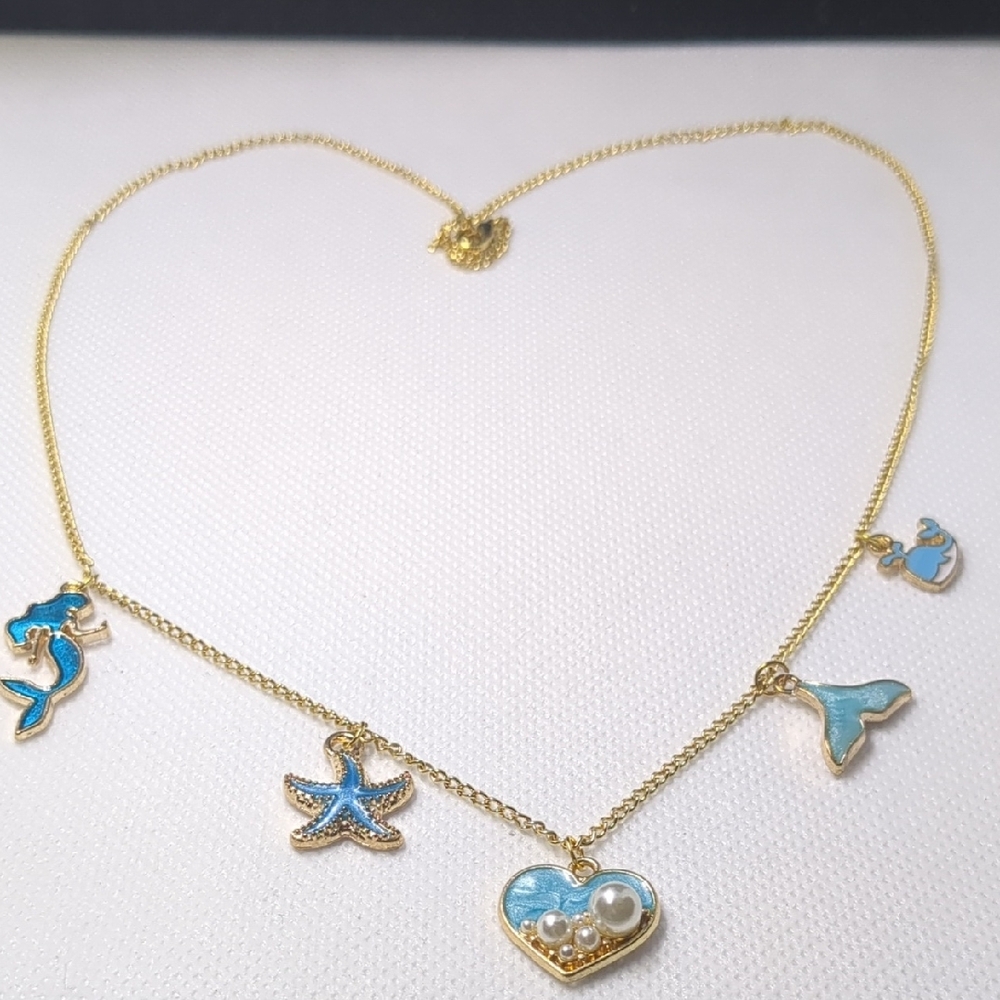 Gold and Blue Charm Necklace with Heart and Butterfly Motifs